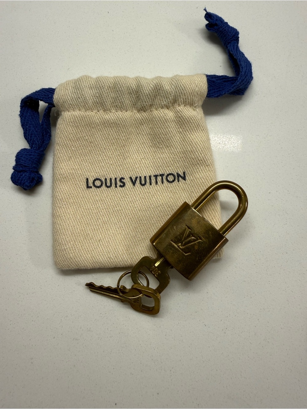 Louis Vuitton Brass Padlock with Blue Drawstring Pouch